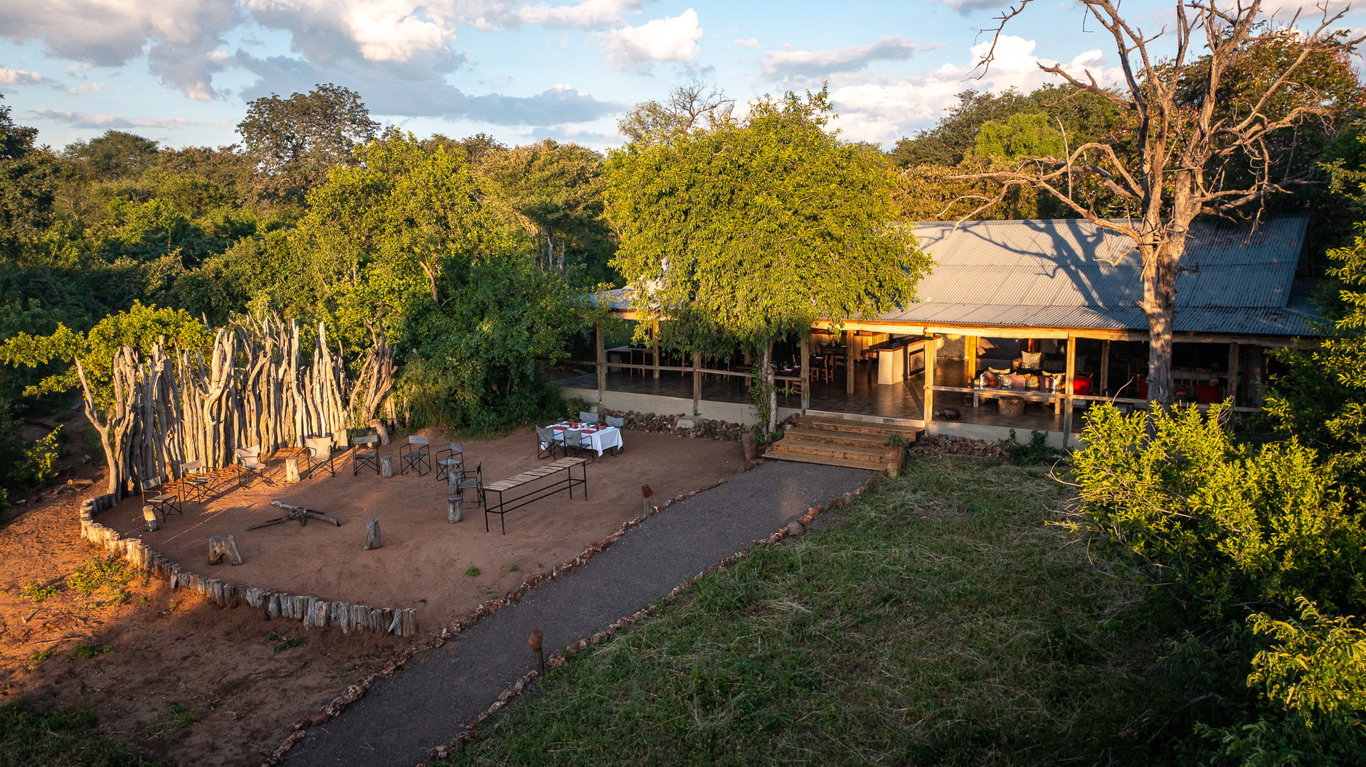 Chobe Elephant Camp among the trees on its ridge in the late afternoon