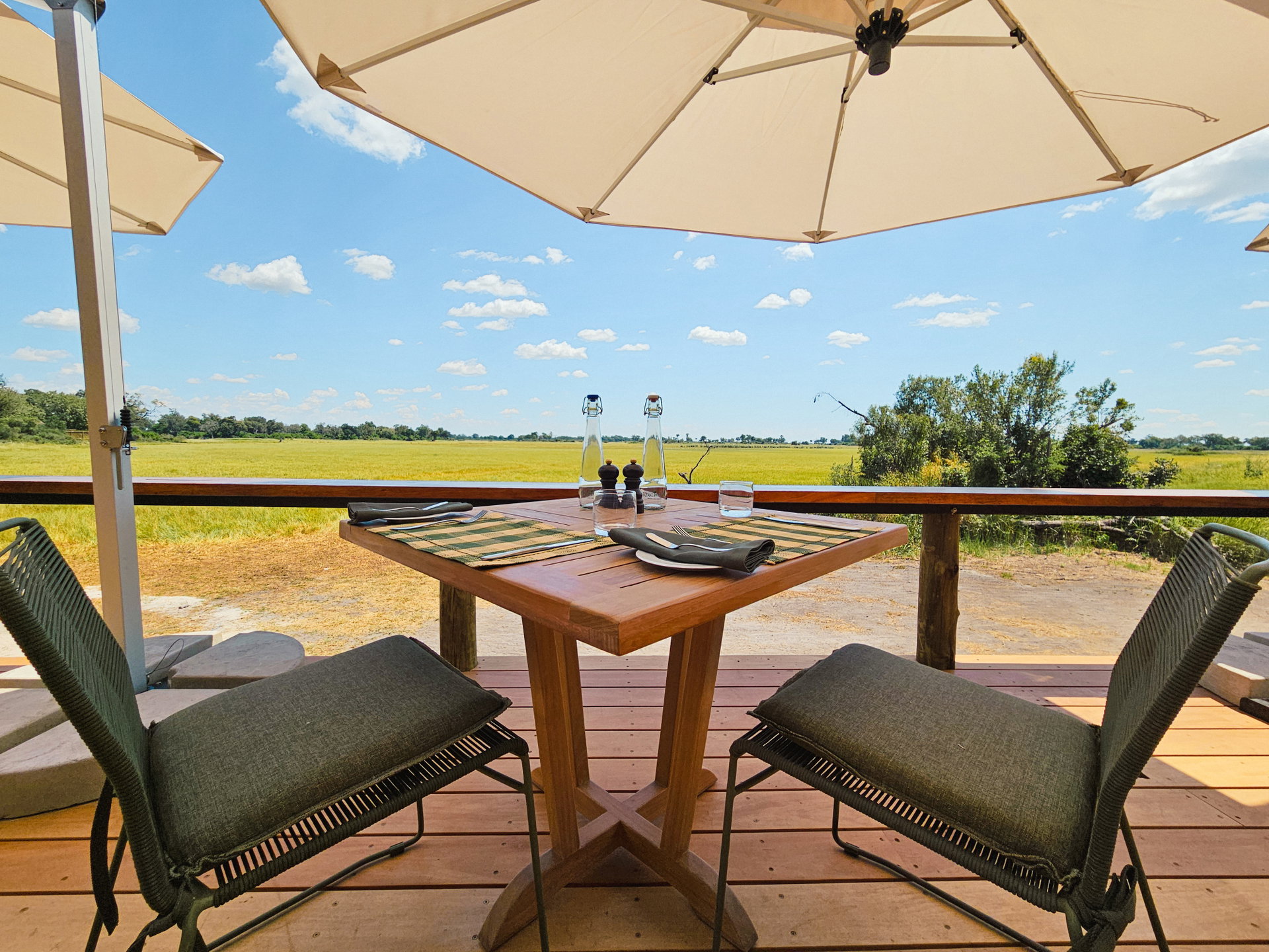 A table for two on the deck at Kanana, looking out over the floodplain