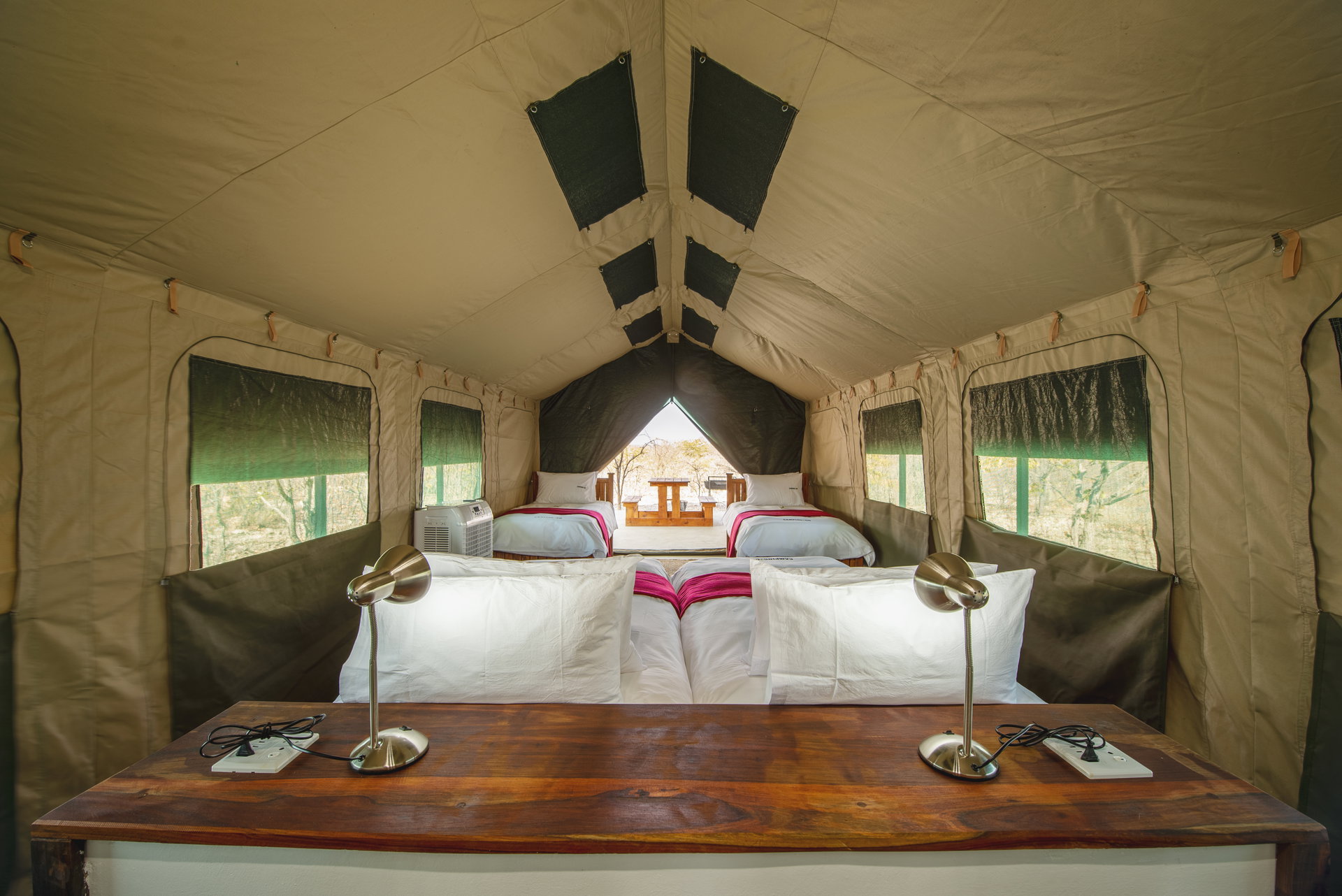 Inside a fixed safari tent with two beds at Etosha Safari Camping2Go