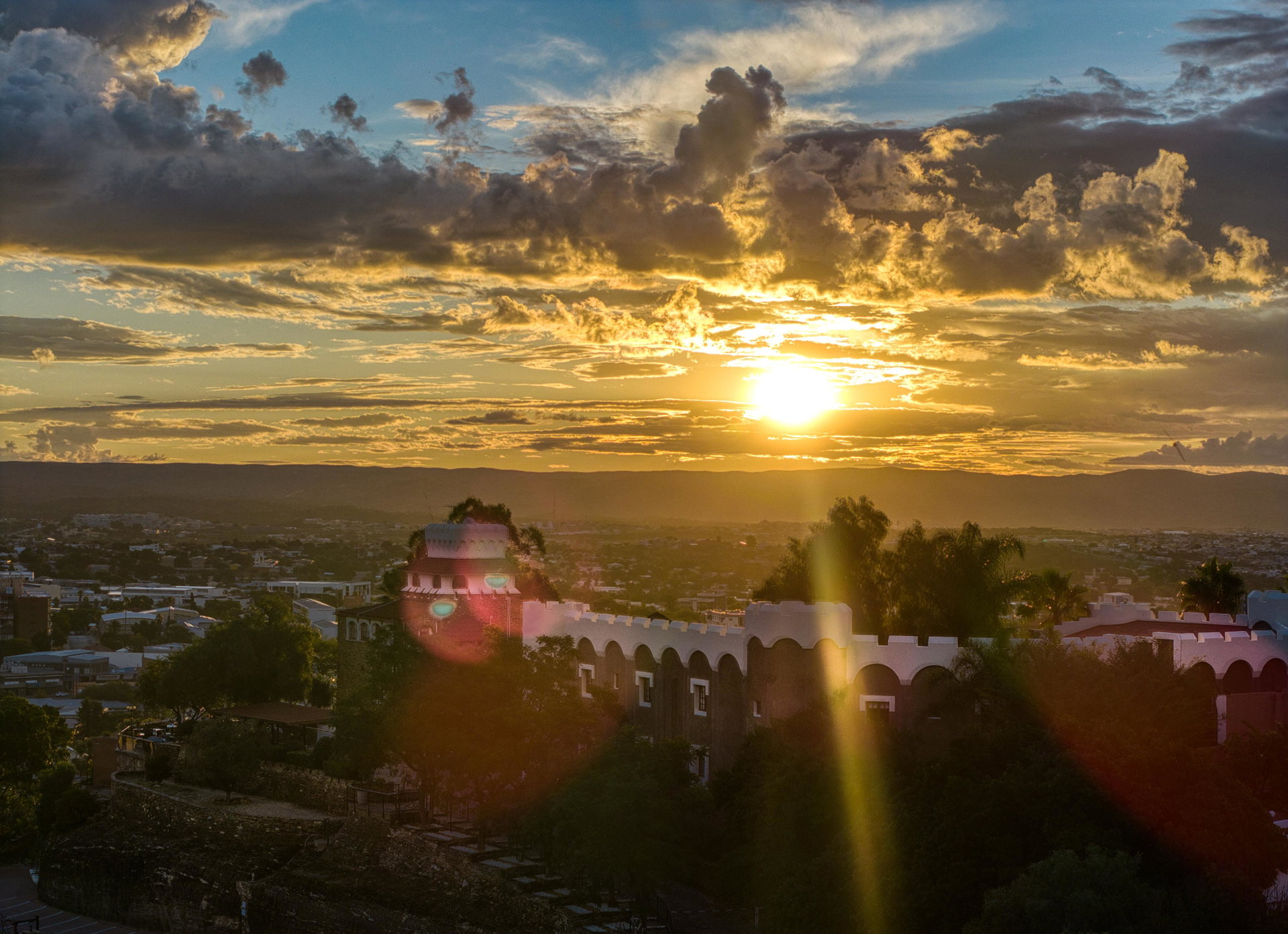 The sun setting over Windhoek seen from the hilltop at Heinitzburg