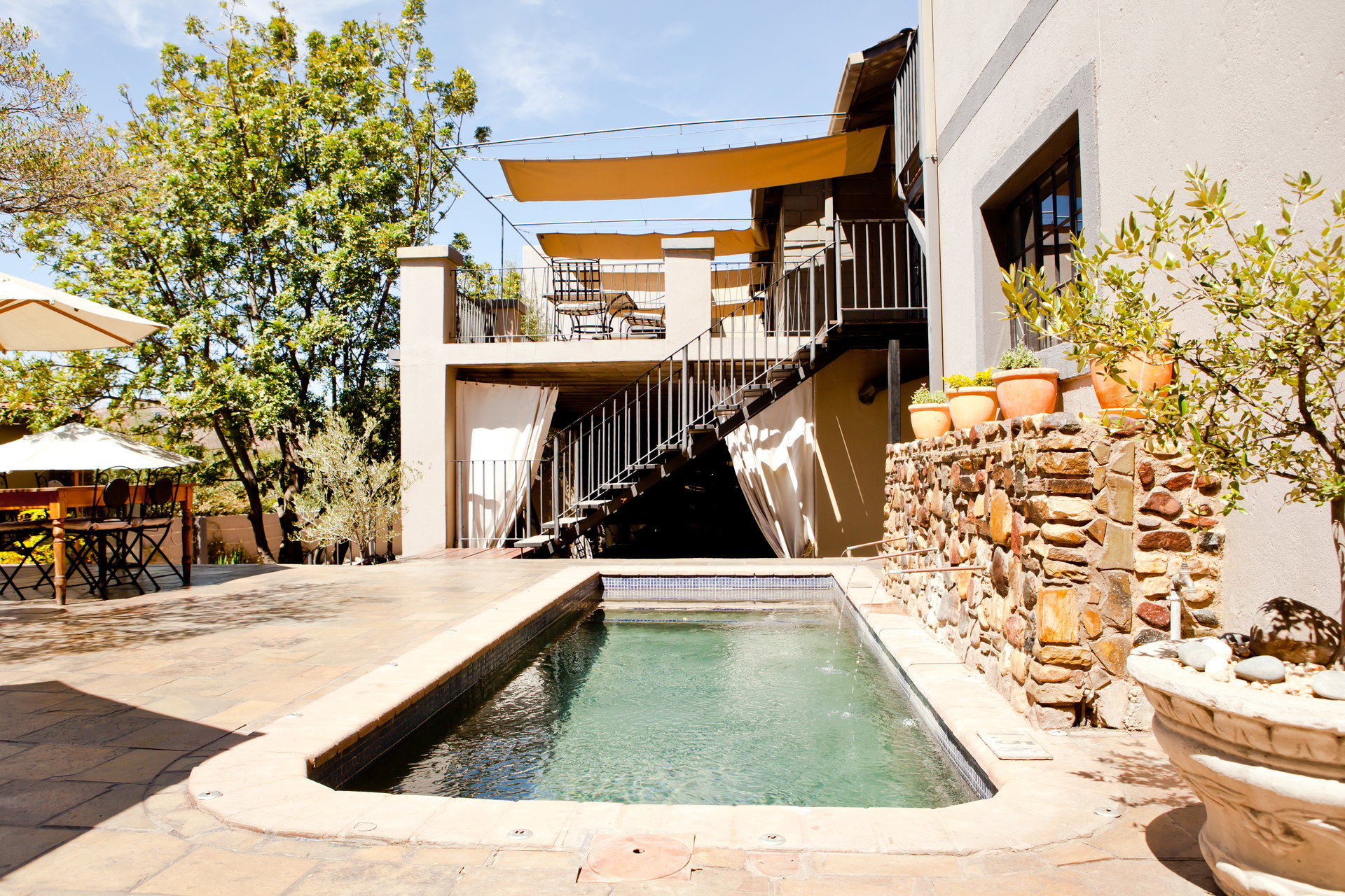 The plunge pool and patio at Olive Grove Guesthouse