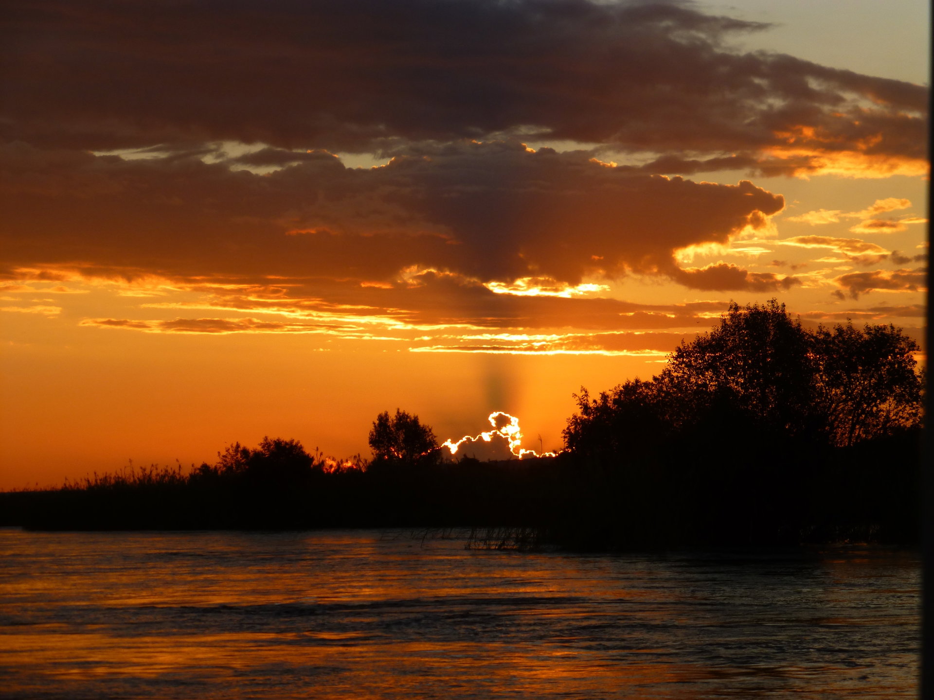 The sun setting over the Zambezi at Waterberry