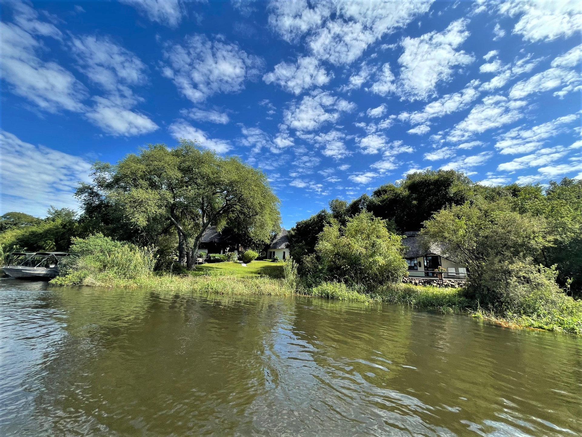 Waterberry Zambezi Lodge among the trees on the bank of the Zambezi